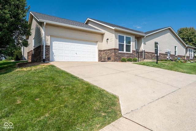 111 Longcastle Dr Apt 4, Greencastle, IN 46135 - view of front of house featuring brick siding, driveway, a garage, and a front lawn