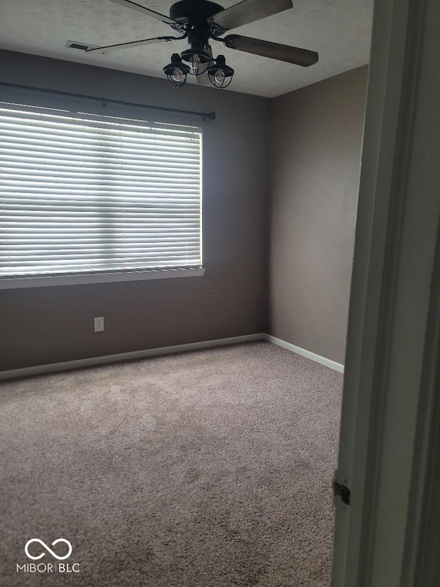 922 Eagle Brook Dr, Shelbyville, IN 46176 - carpeted empty room featuring ceiling fan and baseboards