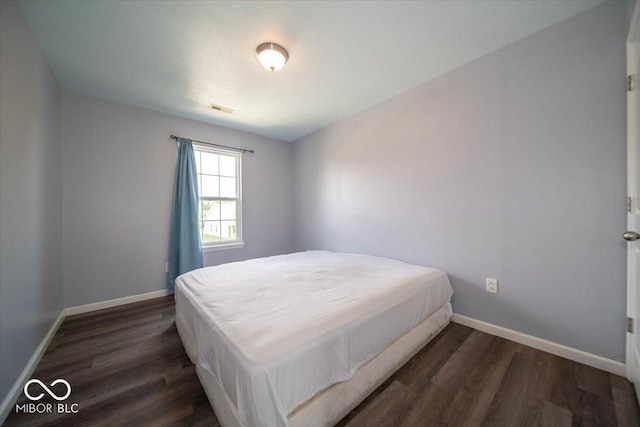 5859 Edelle Dr, Indianapolis, IN 46237 - bedroom featuring wood finished floors and baseboards