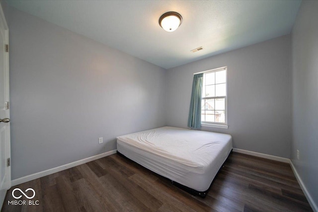 5859 Edelle Dr, Indianapolis, IN 46237 - bedroom featuring wood finished floors and baseboards