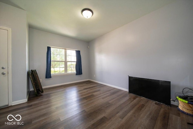 5859 Edelle Dr, Indianapolis, IN 46237 - empty room with dark wood-type flooring and baseboards