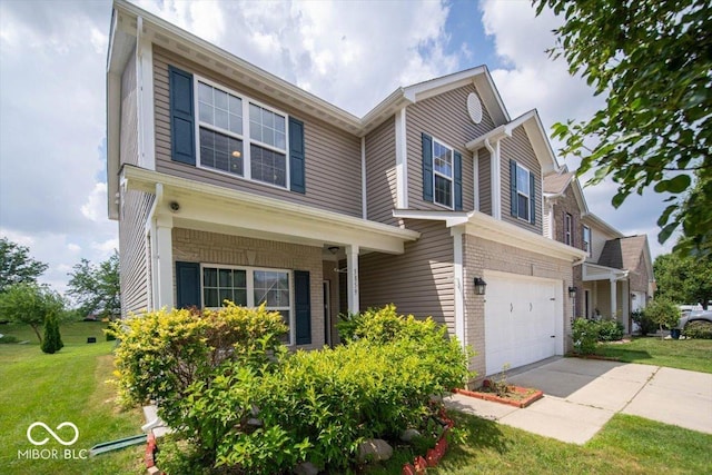 5859 Edelle Dr, Indianapolis, IN 46237 - traditional home with a front yard, driveway, a garage, and brick siding