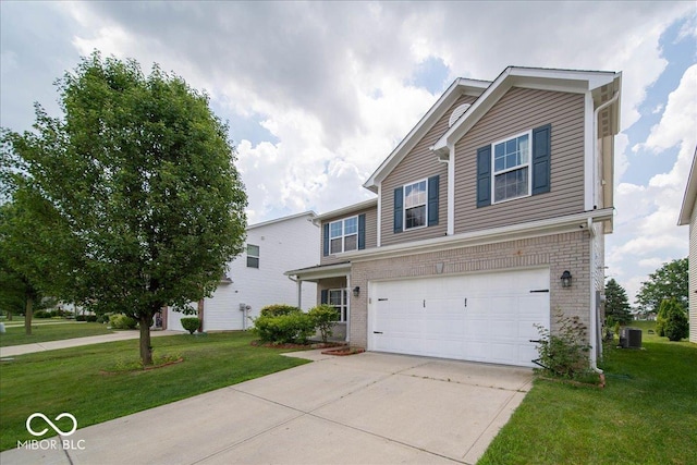 5859 Edelle Dr, Indianapolis, IN 46237 - view of front facade with a garage, brick siding, driveway, and a front yard