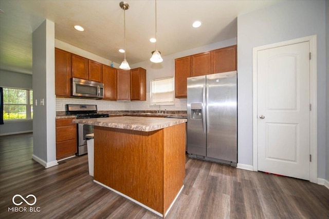 5859 Edelle Dr, Indianapolis, IN 46237 - kitchen with appliances with stainless steel finishes, dark wood-type flooring, brown cabinets, backsplash, and recessed lighting