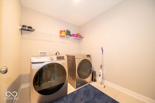 3609 Merchmont Rd, Bargersville, IN 46106 - laundry area featuring washing machine and clothes dryer and tile patterned floors