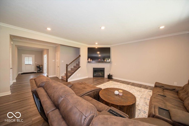 3609 Merchmont Rd, Bargersville, IN 46106 - living area featuring wood finished floors, a glass covered fireplace, stairs, crown molding, and recessed lighting