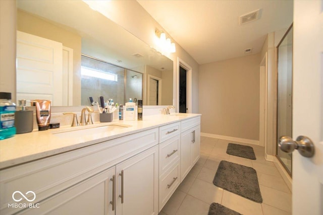 3609 Merchmont Rd, Bargersville, IN 46106 - bathroom with a shower stall, double vanity, and tile patterned floors