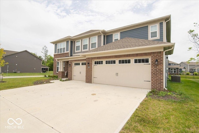 3609 Merchmont Rd, Bargersville, IN 46106 - view of front of home with brick siding, driveway, a front lawn, and a garage