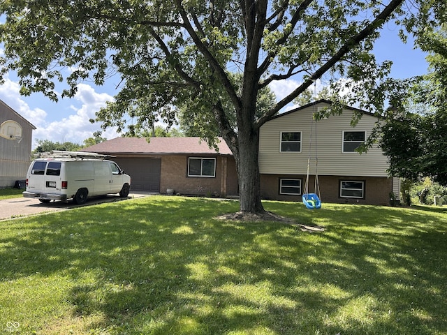 3525 Valley Lake Dr, Indianapolis, IN 46227 - tri-level home with a front yard and an attached garage
