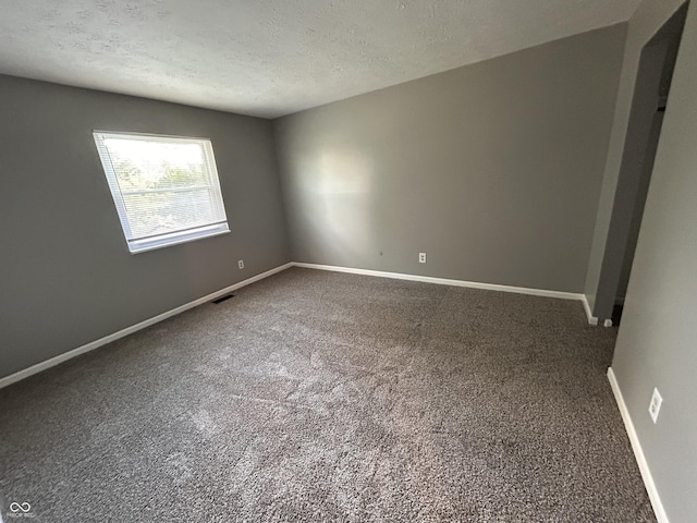 3525 Valley Lake Dr, Indianapolis, IN 46227 - carpeted empty room with a textured ceiling and baseboards