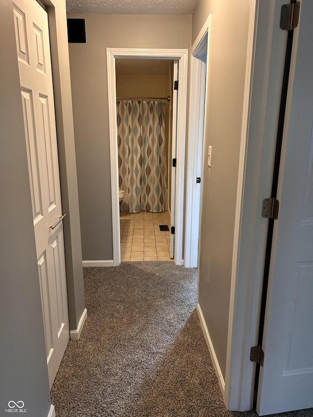 3525 Valley Lake Dr, Indianapolis, IN 46227 - corridor featuring carpet floors and tile patterned floors