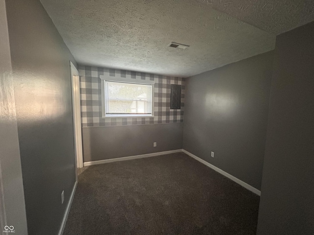 3525 Valley Lake Dr, Indianapolis, IN 46227 - empty room with dark carpet and a textured ceiling