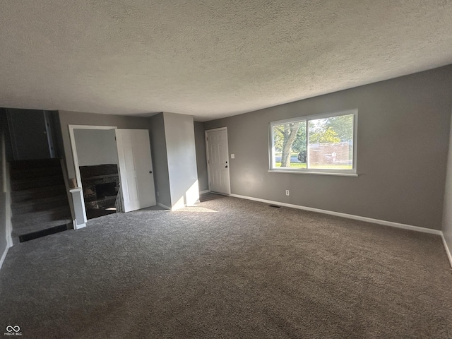 3525 Valley Lake Dr, Indianapolis, IN 46227 - carpeted empty room featuring baseboards and a textured ceiling