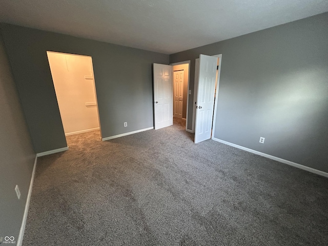 3525 Valley Lake Dr, Indianapolis, IN 46227 - unfurnished bedroom with baseboards and carpet floors