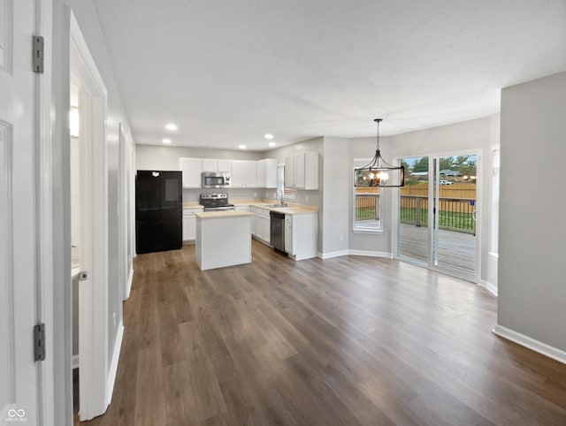 770 Tulip Ln, Greenwood, IN 46143 - kitchen featuring stainless steel appliances, a chandelier, a center island, dark wood finished floors, and recessed lighting
