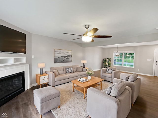 770 Tulip Ln, Greenwood, IN 46143 - living room with wood finished floors, a ceiling fan, and a tiled fireplace