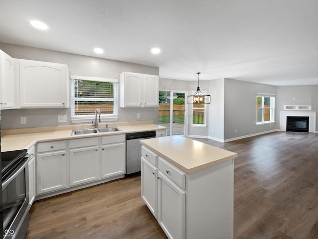 770 Tulip Ln, Greenwood, IN 46143 - kitchen with stainless steel appliances, white cabinetry, dark wood-style flooring, a chandelier, and a center island