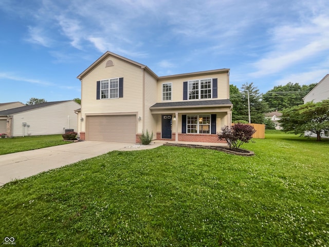 770 Tulip Ln, Greenwood, IN 46143 - traditional-style house with an attached garage, driveway, brick siding, and a front lawn
