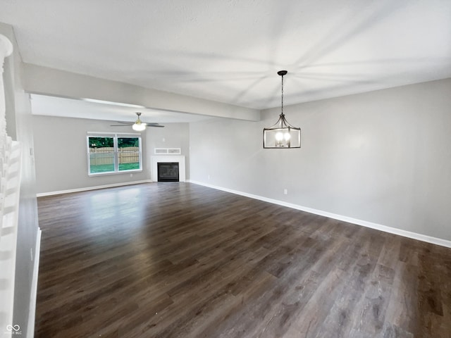 770 Tulip Ln, Greenwood, IN 46143 - unfurnished living room featuring dark wood-type flooring, a glass covered fireplace, and a ceiling fan