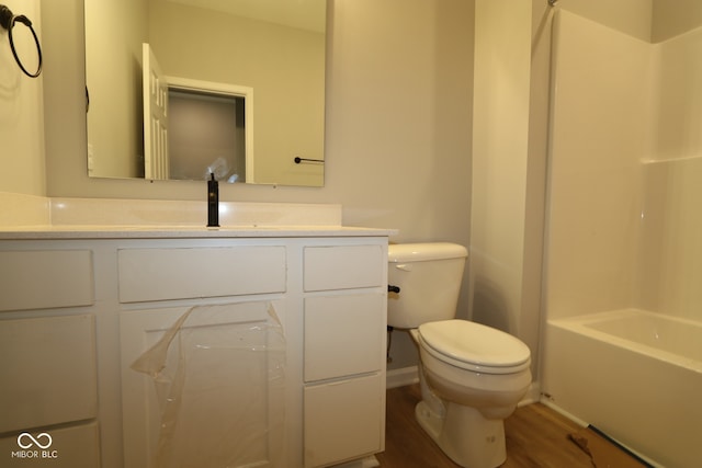 10602 Maidenhair Dr, Indianapolis, IN 46239 - bathroom with wood finished floors, vanity, and washtub / shower combination