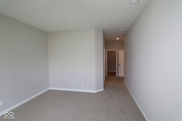 10602 Maidenhair Dr, Indianapolis, IN 46239 - unfurnished room featuring light carpet and a smoke detector