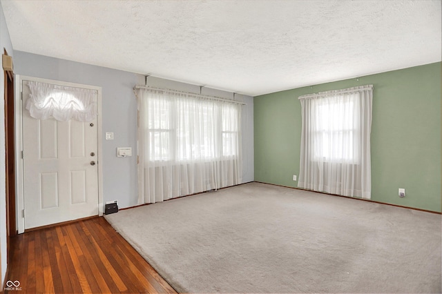3322 N Riley Ave N, Indianapolis, IN 46218 - entryway with a textured ceiling and hardwood / wood-style floors