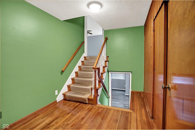 3322 N Riley Ave N, Indianapolis, IN 46218 - stairs featuring wood finished floors and a textured ceiling