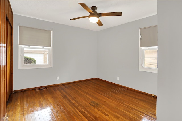 3322 N Riley Ave N, Indianapolis, IN 46218 - spare room featuring hardwood / wood-style floors and a ceiling fan