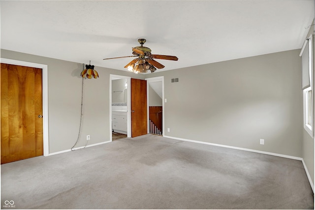 3322 N Riley Ave N, Indianapolis, IN 46218 - unfurnished bedroom featuring carpet flooring, ensuite bathroom, and a ceiling fan