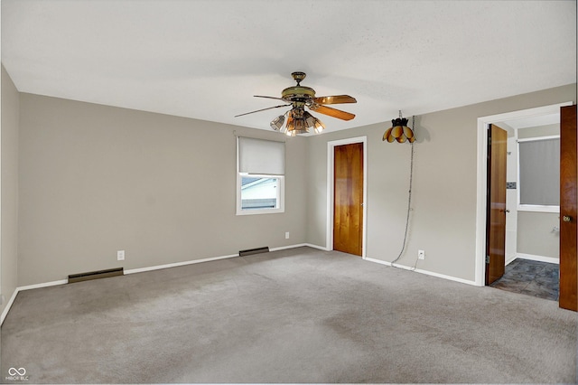 3322 N Riley Ave N, Indianapolis, IN 46218 - unfurnished bedroom with carpet flooring, a baseboard radiator, and ceiling fan