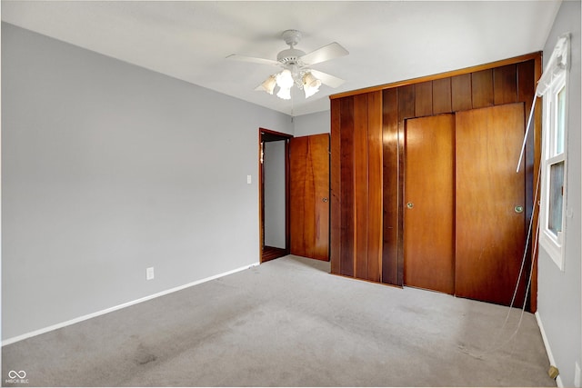 3322 N Riley Ave N, Indianapolis, IN 46218 - unfurnished bedroom with a closet, carpet flooring, and a ceiling fan