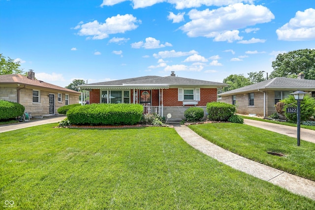 3322 N Riley Ave N, Indianapolis, IN 46218 - view of front of house featuring brick siding and a front yard