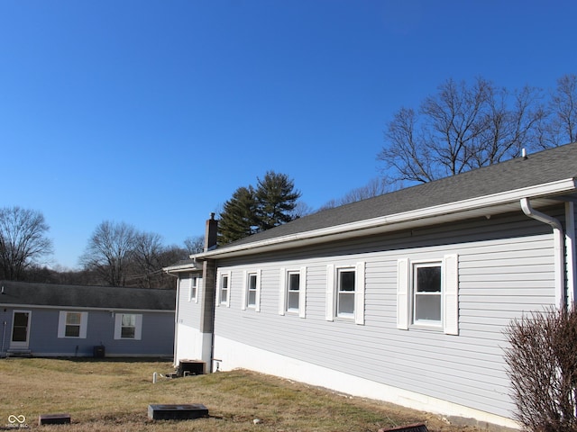 1267 W 750 S, Trafalgar, IN 46181 - view of home's exterior with a lawn and a chimney