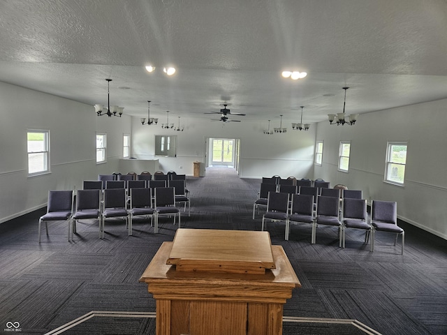 1267 W 750 S, Trafalgar, IN 46181 - cinema room with dark carpet, a chandelier, a textured ceiling, and plenty of natural light