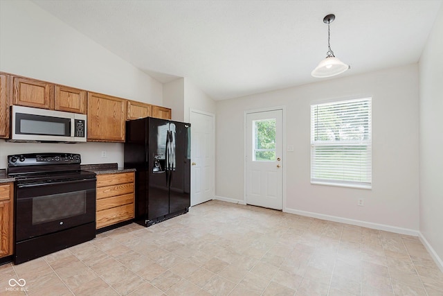 12121 Driftstone Dr, Fishers, IN 46037 - kitchen with black appliances, dark countertops, brown cabinetry, pendant lighting, and vaulted ceiling