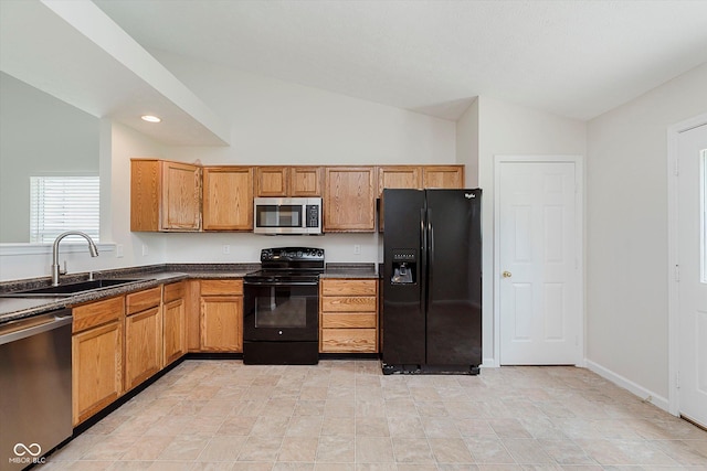 12121 Driftstone Dr, Fishers, IN 46037 - kitchen featuring black appliances, lofted ceiling, dark countertops, recessed lighting, and brown cabinets