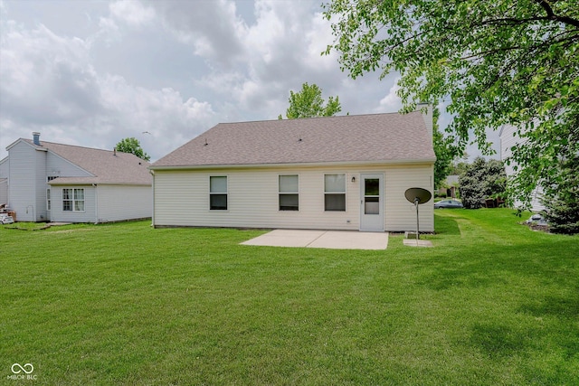 12121 Driftstone Dr, Fishers, IN 46037 - back of house featuring a patio area and a lawn