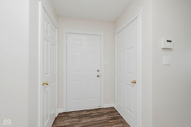 12121 Driftstone Dr, Fishers, IN 46037 - doorway featuring dark wood-style flooring and baseboards