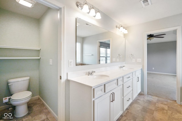 6670 Shooting Star Dr, Whitestown, IN 46075 - full bathroom with double vanity, a ceiling fan, and stone finish floors
