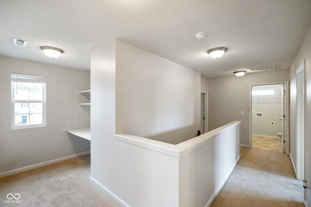 6670 Shooting Star Dr, Whitestown, IN 46075 - hallway featuring light colored carpet and an upstairs landing