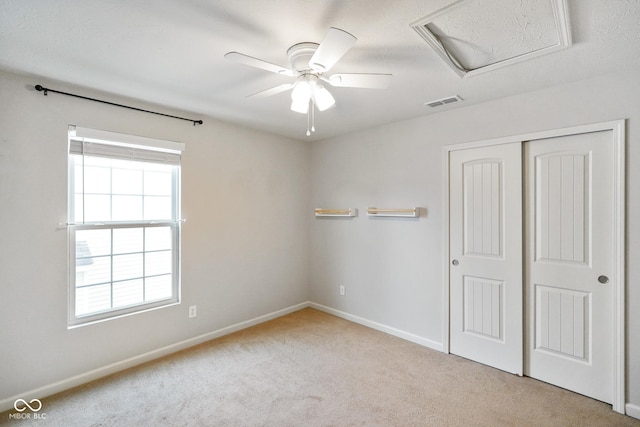 6670 Shooting Star Dr, Whitestown, IN 46075 - unfurnished bedroom with carpet, attic access, a closet, and ceiling fan