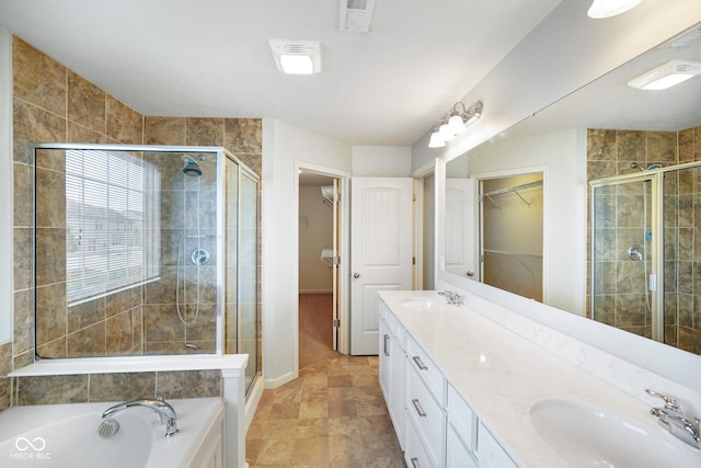 6670 Shooting Star Dr, Whitestown, IN 46075 - full bathroom featuring a spacious closet, a shower stall, and double vanity