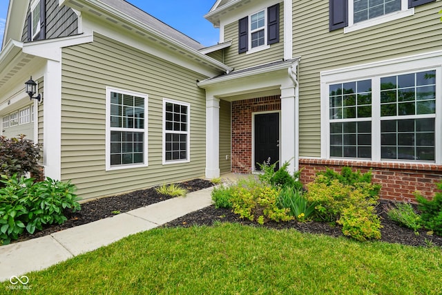 6670 Shooting Star Dr, Whitestown, IN 46075 - entrance to property with brick siding and a lawn