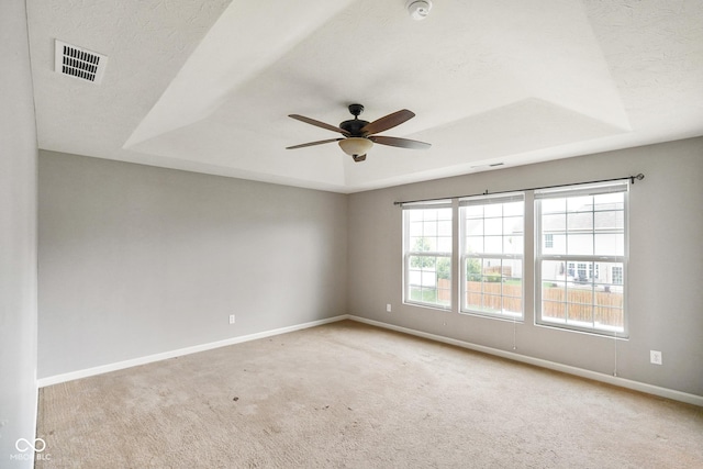6670 Shooting Star Dr, Whitestown, IN 46075 - spare room with a raised ceiling, carpet, ceiling fan, and a smoke detector