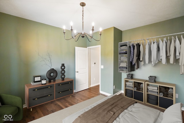 6670 Shooting Star Dr, Whitestown, IN 46075 - bedroom featuring wood finished floors and a chandelier