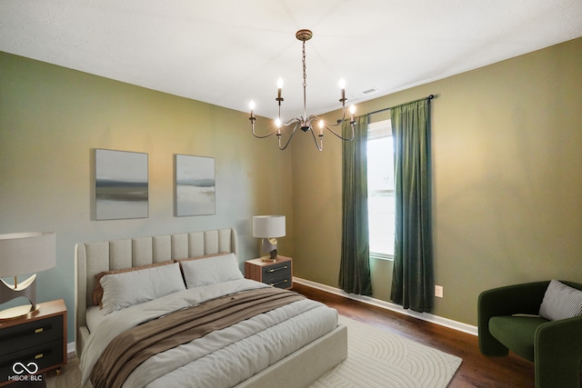 6670 Shooting Star Dr, Whitestown, IN 46075 - bedroom with a chandelier and dark wood-type flooring
