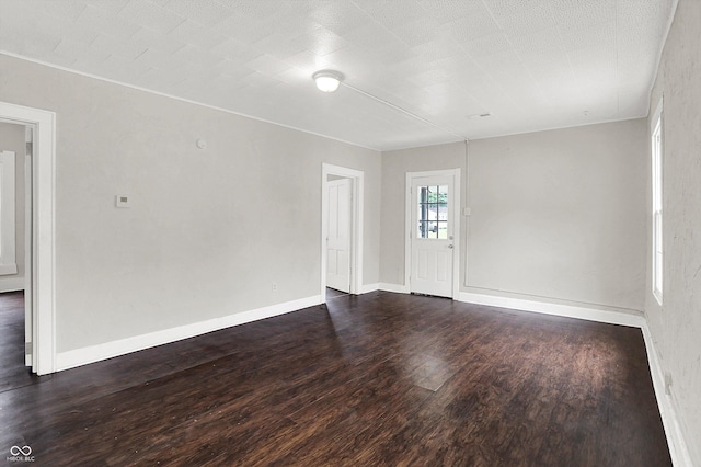1418 W 5th St, Anderson, IN 46016 - empty room with wood finished floors and baseboards