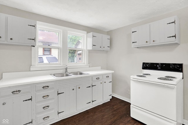 1418 W 5th St, Anderson, IN 46016 - kitchen featuring electric range, dark wood-type flooring, light countertops, and white cabinetry