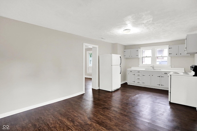 1418 W 5th St, Anderson, IN 46016 - kitchen featuring white appliances, dark wood finished floors, and light countertops