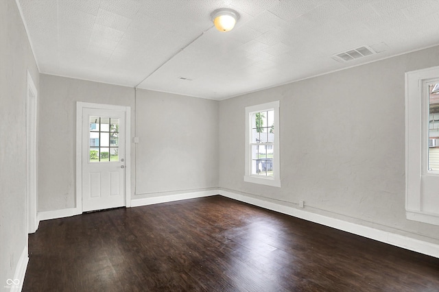 1418 W 5th St, Anderson, IN 46016 - spare room featuring dark wood-style floors